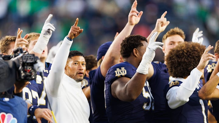 Notre Dame head coach Marcus Freeman celebrates with his players after winning a NCAA football game 36-7 against NC State at Notre Dame Stadium on Saturday, Oct. 11, 2025, in South Bend.