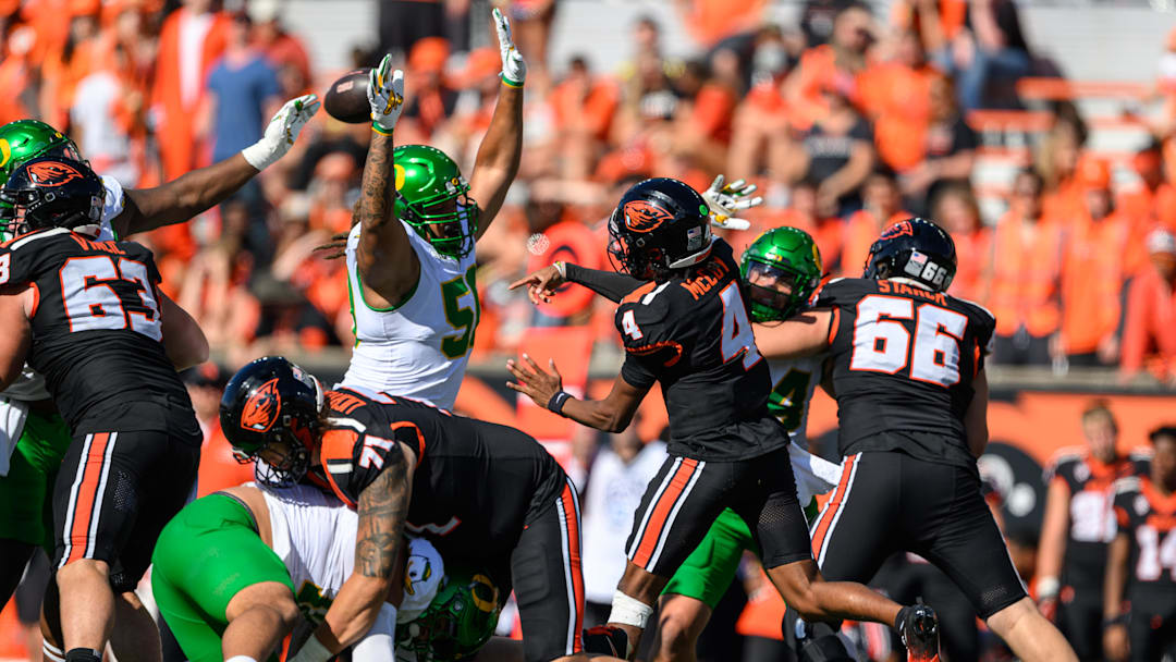 Sep 14, 2024; Corvallis, Oregon, USA; Oregon Ducks defensive lineman Tionne Gray (50) with pressure on Oregon State Beavers quarterback Gevani McCoy (4) during the second half at Reser Stadium. Mandatory Credit: Craig Strobeck-Imagn Images
