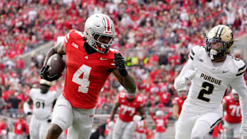 Nov 9, 2024; Columbus, Ohio, USA; Ohio State Buckeyes wide receiver Jeremiah Smith (4) dances into the end zone untouched by Purdue Boilermakers defensive back Nyland Green (2) during the first half at Ohio Stadium. Mandatory Credit: Barbara Perenic/USA TODAY Network via Imagn Images
