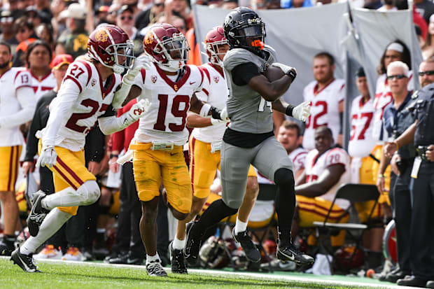Sep 30, 2023; Boulder, Colorado, USA; Colorado Buffaloes wide receiver Omarion Miller (14) runs the ball past USC Trojans def