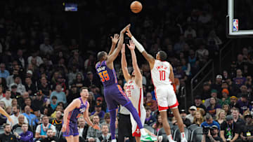 Feb 29, 2024; Phoenix, Arizona, USA; Phoenix Suns forward Kevin Durant (35) shoots over Houston Rockets center Alperen Sengun (28) and Houston Rockets forward Jabari Smith Jr. (10) during the first half at Footprint Center. Mandatory Credit: Joe Camporeale-Imagn Images