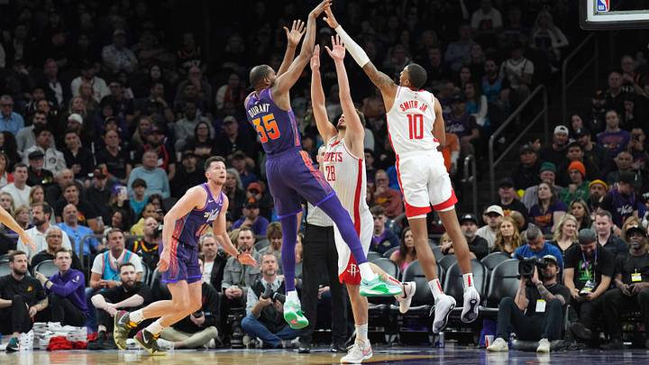 Feb 29, 2024; Phoenix, Arizona, USA; Phoenix Suns forward Kevin Durant (35) shoots over Houston Rockets center Alperen Sengun (28) and Houston Rockets forward Jabari Smith Jr. (10) during the first half at Footprint Center. Mandatory Credit: Joe Camporeale-Imagn Images