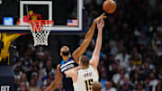 Minnesota Timberwolves center Rudy Gobert blocks the shot of Denver Nuggets center Nikola Jokic in the second quarter at Ball Arena in Denver on March 12, 2025.