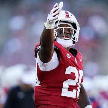 Sep 7, 2024; Stanford, California, USA; Stanford Cardinal running back Micah Ford (20) celebrates after a play against the Cal Poly Mustangs during the second quarter at Stanford Stadium. Mandatory Credit: Sergio Estrada-Imagn Images