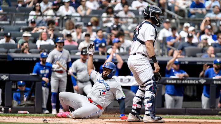 Aug 22, 2026; Bronx, New York, USA;  Toronto Blue Jays first baseman Vladimir Guerrero (27) scores a run on a RBI single by designated hitter George Springer (not pictured) during the first inning against the New York Yankees at Yankee Stadium.  Mandatory Credit: John Jones-Imagn Images