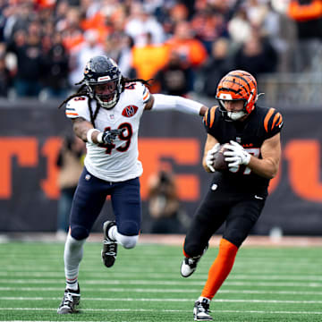 Tanner Hudson makes a catch with Tremaine Edmunds in tow during the Bears' 47-42 win over the Bengals.