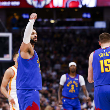 Apr 6, 2024; Denver, Colorado, USA; Denver Nuggets guard Jamal Murray (27) celebrates after making a three-point shot against the Atlanta Hawks in the first half at Ball Arena. Mandatory Credit: Michael Ciaglo-USA TODAY Sports