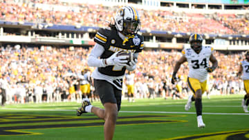 Dec 30, 2024; Nashville, TN, USA;  Missouri Tigers wide receiver Marquis Johnson (2) makes a catch for a touchdown against the Iowa Hawkeyes  during the first half at Nissan Stadium. Mandatory Credit: Steve Roberts-Imagn Images
