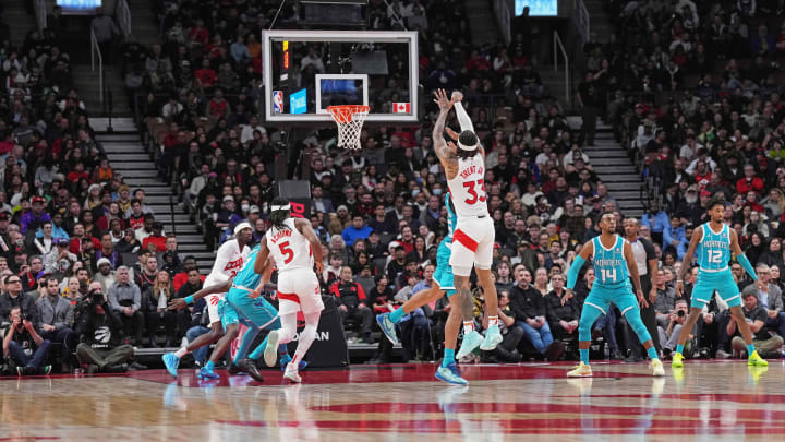 Dec 18, 2023; Toronto, Ontario, CAN; Toronto Raptors guard Gary Trent Jr. (33) shoots the ball at the basket against the Charlotte Hornets during the fourth quarter at Scotiabank Arena. Mandatory Credit: Nick Turchiaro-USA TODAY Sports