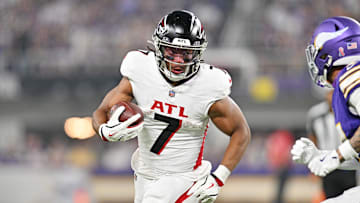 Sep 14, 2025; Minneapolis, Minnesota, USA; Atlanta Falcons running back Bijan Robinson (7) runs the ball during the first half against the Minnesota Vikings at U.S. Bank Stadium. Mandatory Credit: Jeffrey Becker-Imagn Images