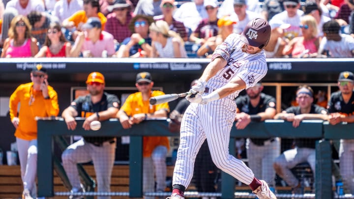 Jun 23, 2024; Omaha, NE, USA; Texas A&M Aggies designated hitter Hayden Schott (5) hits a single against the Tennessee Volunteers during the fourth inning at Charles Schwab Field Omaha. Mandatory Credit: Dylan Widger-USA TODAY Sports