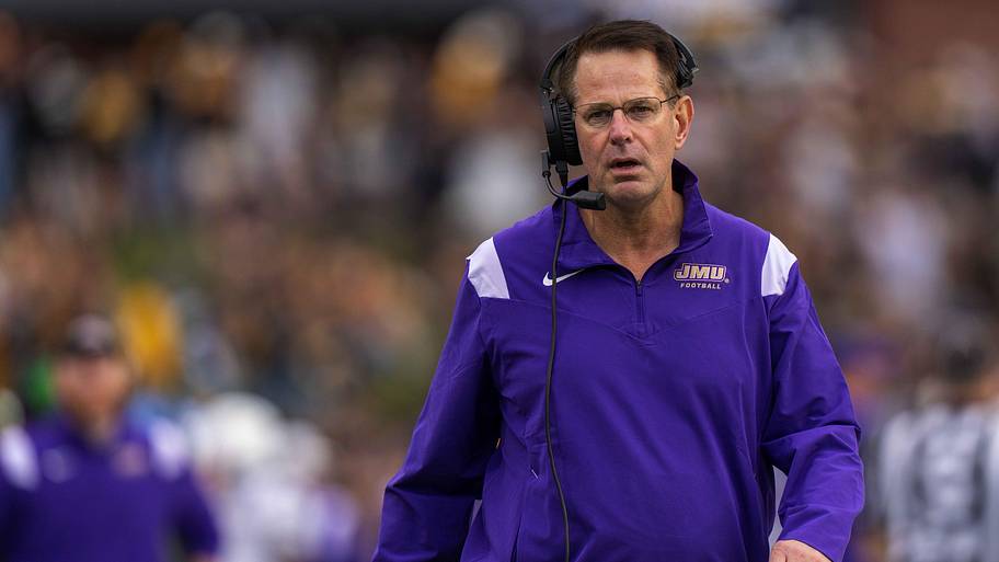 James Madison Dukes head coach Curt Cignetti walks the sideline during a game against the Appalachian State Mountaineers.