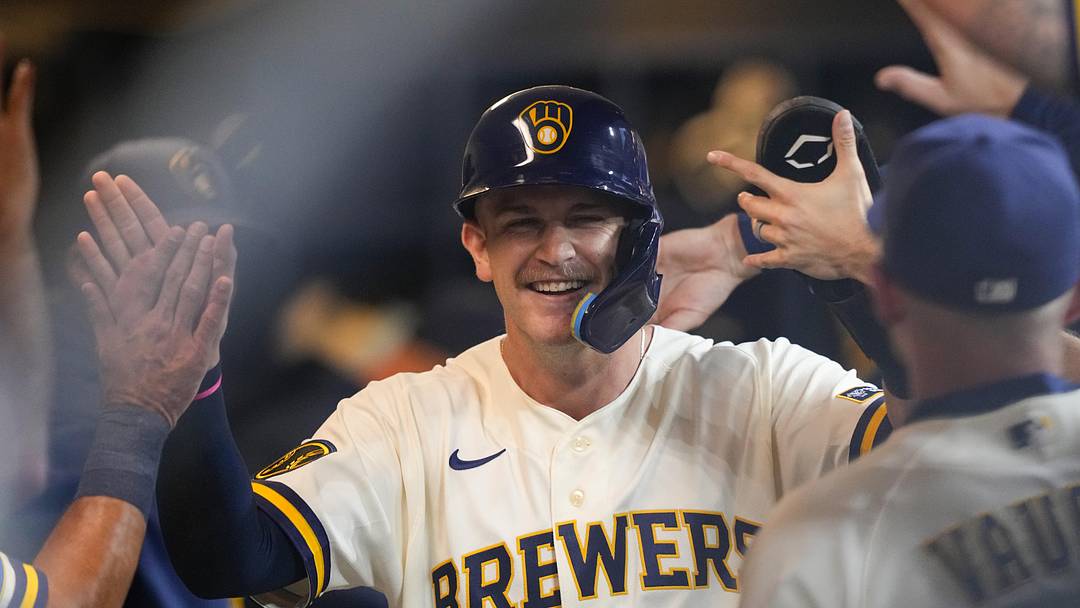 Jun 17, 2026; Milwaukee, Wisconsin, USA;  Milwaukee Brewers shortstop Cooper Pratt (12) high fives teammates in the dugout after scoring a run during the second inning against the Cleveland Guardians at American Family Field. Mandatory Credit: Jeff Hanisch-Imagn Images