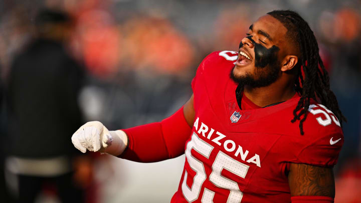 Dec 24, 2023; Chicago, Illinois, USA;  Arizona Cardinals defensive tackle Dante Stills (55) stretches on the field before a game against the Chicago Bears at Soldier Field. Mandatory Credit: Jamie Sabau-USA TODAY Sports