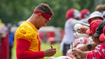 Jul 22, 2025; St. Joseph, MO, USA; Kansas City Chiefs quarterback Patrick Mahomes (15) signs autographs for fans after training camp at Missouri Western State University. Mandatory Credit: Denny Medley-Imagn Images