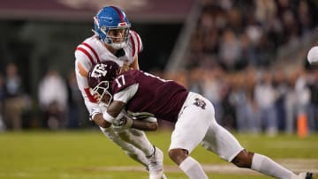 Oct 29, 2022; College Station, Texas, USA;  Texas A&M Aggies defensive back Jaylon Jones (17) tackles Mississippi Rebels quarterback Jaxson Dart (2) in the first half at Kyle Field. Mandatory Credit: Daniel Dunn-USA TODAY Sports