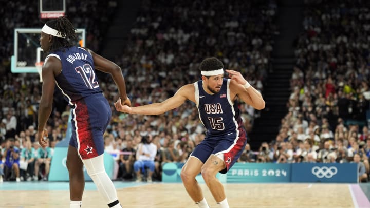 Aug 6, 2024; Paris, France; United States guard Devin Booker (15) reacts with guard Jrue Holiday (12) in the first quarter against Brazil in a men’s basketball quarterfinal game during the Paris 2024 Olympic Summer Games at Accor Arena. Mandatory Credit: Kyle Terada-USA TODAY Sports