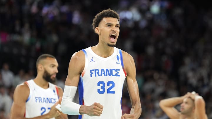 Aug 6, 2024; Paris, France; France power forward Victor Wembanyama (32) celebrates after defeating Canada in a men’s basketball quarterfinal game during the Paris 2024 Olympic Summer Games at Accor Arena. Mandatory Credit: Kyle Terada-USA TODAY Sports