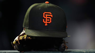 General view of a San Francisco Giants cap and glove during the ninth inning against the Colorado Rockies at Coors Field in Denver in September 2003.