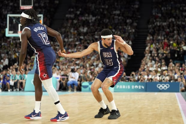 Team USA guard Devin Booker celebrates during the Olympics.