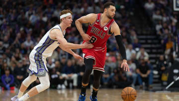 Dec 4, 2022; Sacramento, California, USA;  Sacramento Kings guard Kevin Huerter (9) attempts to defend against Chicago Bulls guard Zach LaVine (8) during the fourth quarter at Golden 1 Center. Mandatory Credit: Stan Szeto-USA TODAY Sports