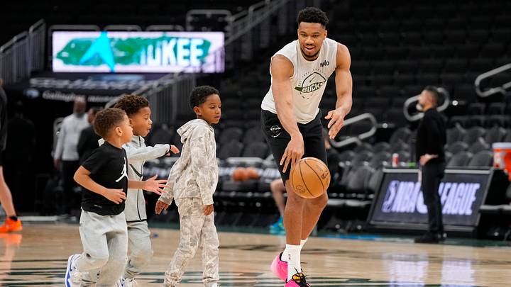 Mar 28, 2026; Milwaukee, Wisconsin, USA;  Milwaukee Bucks forward Giannis Antetokounmpo (34) plays with his children during warm ups prior to the game against the San Antonio Spurs at Fiserv Forum. Mandatory Credit: Jeff Hanisch-Imagn Images