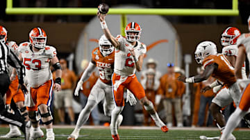 Dec 21, 2024; Austin, Texas, USA; Clemson Tigers quarterback Cade Klubnik (2) passes the ball for a first down against the Texas Longhorns during the second half of the CFP National Playoff first round game at Darrell K Royal-Texas Memorial Stadium. Mandatory Credit: Jerome Miron-Imagn Images