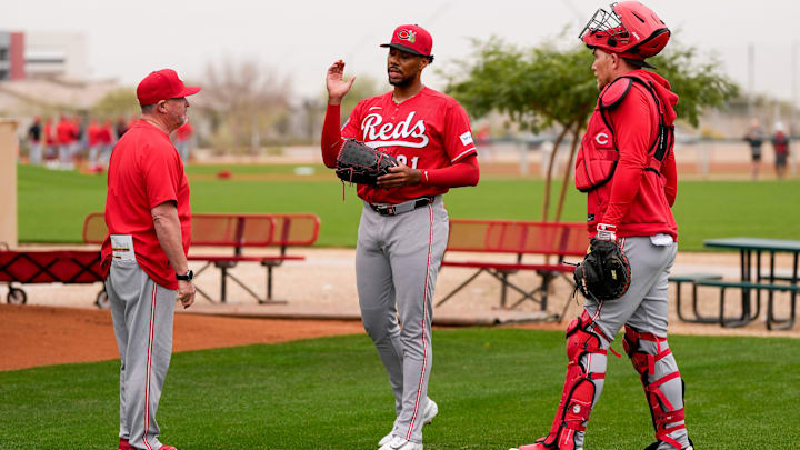Cincinnati Reds pitching coach/director of pitching Derek Johnson (36) wraps up a bullpen session with pitcher Hunter Greene (21) at the Cincinnati Reds player development complex in Goodyear, Ariz., on Friday, Feb. 13, 2026.