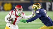 Oct 14, 2023; South Bend, Indiana, USA; USC Trojans wide receiver Zachariah Branch (1) carries as Notre Dame Fighting Irish safety Ramon Henderson (11) defends in the first quarter at Notre Dame Stadium. Mandatory Credit: Matt Cashore-USA TODAY Sports