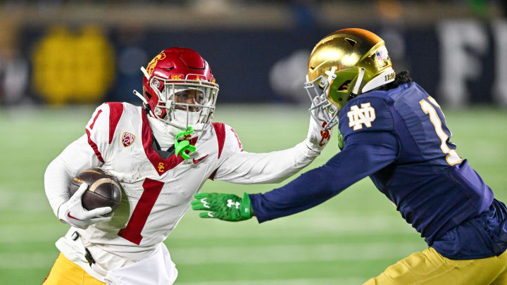 Oct 14, 2023; South Bend, Indiana, USA; USC Trojans wide receiver Zachariah Branch (1) carries as Notre Dame Fighting Irish safety Ramon Henderson (11) defends in the first quarter at Notre Dame Stadium. Mandatory Credit: Matt Cashore-USA TODAY Sports