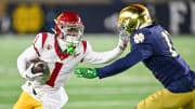 Oct 14, 2023; South Bend, Indiana, USA; USC Trojans wide receiver Zachariah Branch (1) carries as Notre Dame Fighting Irish safety Ramon Henderson (11) defends in the first quarter at Notre Dame Stadium. 