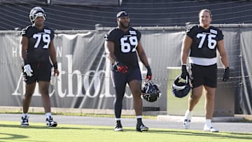 Houston Texans offensive tackle Aireontae Ersery (79) and guard Ed Ingram (69) and tackle Austin Deculus (76) during training camp at Houston Methodist Training Center.