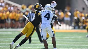 Sep 2, 2023; Iowa City, Iowa, USA; Iowa Hawkeyes defensive back Xavier Nwankpa (1) intercepts a pass as Utah State Aggies wide receiver Micah Davis (4) attempts to catch the ball during the second quarter at Kinnick Stadium. Mandatory Credit: Jeffrey Becker-USA TODAY Sports