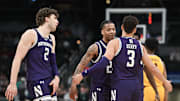Mar 12, 2025; Indianapolis, IN, USA; Northwestern Wildcats guard K.J. Windham (24) and Northwestern Wildcats guard Ty Berry (3) celebrate after a play during the second half against the Minnesota Golden Gophers at Gainbridge Fieldhouse. Mandatory Credit: Robert Goddin-Imagn Images