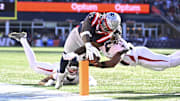 Nov 2, 2025; Foxborough, Massachusetts, USA;  New England Patriots wide receiver Stefon Diggs (8) runs for a touchdown against Atlanta Falcons safety Jessie Bates III (3) and cornerback Mike Hughes (21) during the first half at Gillette Stadium. Mandatory Credit: Eric Canha-Imagn Images