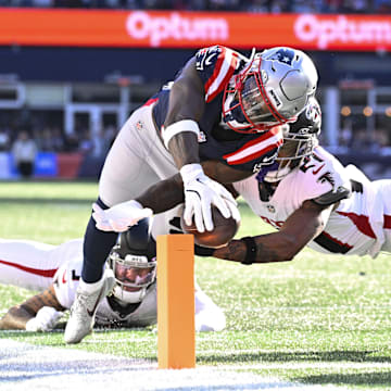 Nov 2, 2025; Foxborough, Massachusetts, USA;  New England Patriots wide receiver Stefon Diggs (8) runs for a touchdown against Atlanta Falcons safety Jessie Bates III (3) and cornerback Mike Hughes (21) during the first half at Gillette Stadium. Mandatory Credit: Eric Canha-Imagn Images