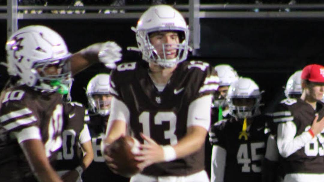 Mount Carmel quarterback Brady Cloherty (13) transferred to the Caravan this year with no guarantee of being the team's starting quarterback. On Friday he threw seven touchdown passes for the second time this season.
