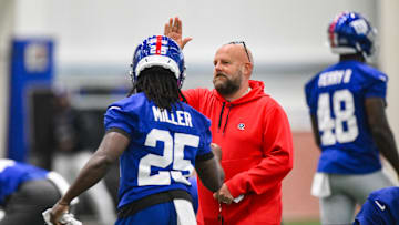 New York Giants head coach Brian Daboll greets running back Dante Miller during minicamp after of the 2025 NFL season