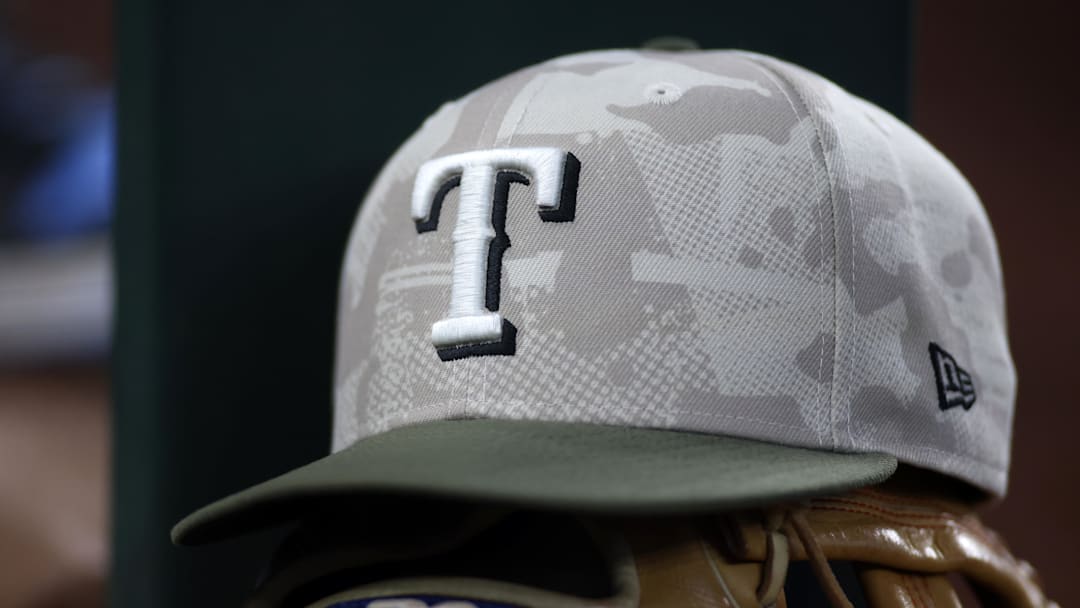 May 18, 2025; Arlington, Texas, USA;  Texas Rangers hat in honor of the military in the dugout during the second inning against the Houston Astros at Globe Life Field.