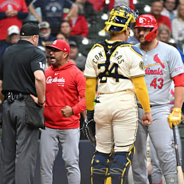 Sep 3, 2024; Milwaukee, Wisconsin, USA; St. Louis Cardinals manager Oliver Marmol (37) argues with umpire Lance Barrett (16) in the fourth inning against the Milwaukee Brewers at American Family Field. St. Louis Cardinals manager Oliver Marmol (37) was ejected. Mandatory Credit: Michael McLoone-Imagn Images