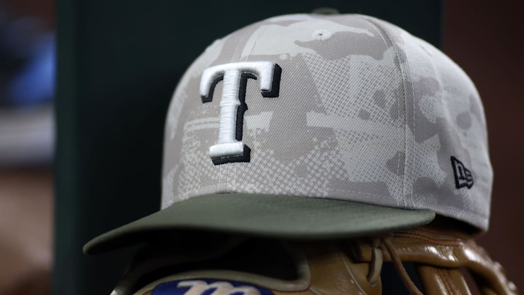 May 18, 2025; Arlington, Texas, USA;  Texas Rangers hat in honor of the military in the dugout  during the second inning against the Houston Astros at Globe Life Field. 