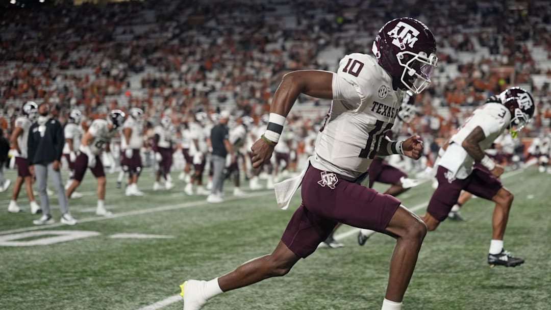 Nov 22, 2025; Austin, Texas, USA; Texas A&M Aggies quarterback Marcel Reed (10) warms up before a game against the Texas Longhorns at Darrell K Royal-Texas Memorial Stadium. Mandatory Credit: Scott Wachter-Imagn Images