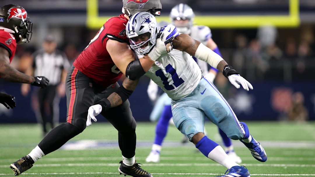 Dec 22, 2024; Arlington, Texas, USA; Dallas Cowboys linebacker Micah Parsons (11) rushes the passer against Tampa Bay Buccaneers offensive tackle Luke Goedeke (67) in the fourth quarter at AT&T Stadium. Mandatory Credit: Tim Heitman-Imagn Images