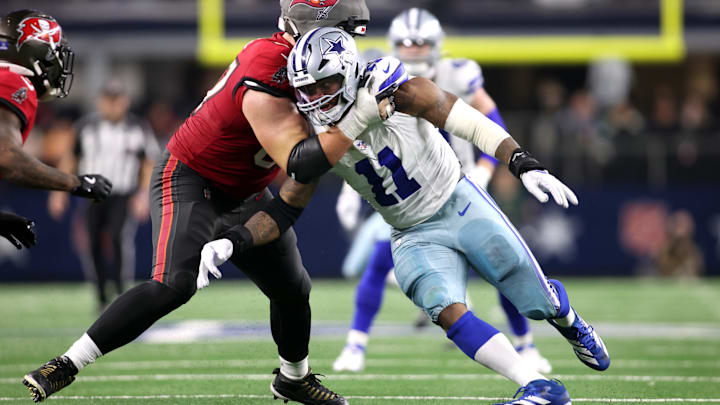 Dec 22, 2024; Arlington, Texas, USA; Dallas Cowboys linebacker Micah Parsons (11) rushes the passer against Tampa Bay Buccaneers offensive tackle Luke Goedeke (67) in the fourth quarter at AT&T Stadium. Mandatory Credit: Tim Heitman-Imagn Images
