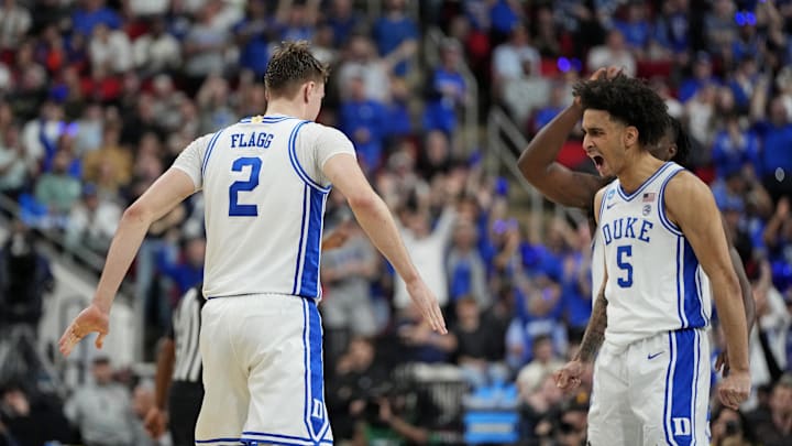 Mar 23, 2025; Raleigh, NC, USA; Duke Blue Devils forward Cooper Flagg (2) reacts after scoring a basket with Duke Blue Devils guard Tyrese Proctor (5) during the first half against the Baylor Bears in the second round of the NCAA Tournament at Lenovo Center. Mandatory Credit: Bob Donnan-Imagn Images
