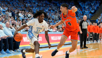 Feb 22, 2025; Chapel Hill, North Carolina, USA; St. John's basketball guard Ian Jackson (11) with the ball as Virginia Cavaliers guard Ishan Sharma (9) defends in the second half at Dean E. Smith Center. 