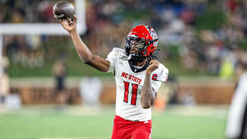 Sep 11, 2025; Winston-Salem, North Carolina, USA;  North Carolina State Wolfpack quarterback CJ Bailey (11) throws a pass in first half against the Wake Forest Demon Deacons at Allegacy Federal Credit Union Stadium. Mandatory Credit: Luke Jamroz-Imagn Images