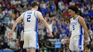 Mar 23, 2025; Raleigh, NC, USA; Duke Blue Devils forward Cooper Flagg (2) reacts after scoring a basket with Duke Blue Devils guard Tyrese Proctor (5) during the first half against the Baylor Bears in the second round of the NCAA Tournament at Lenovo Center. Mandatory Credit: Bob Donnan-Imagn Images