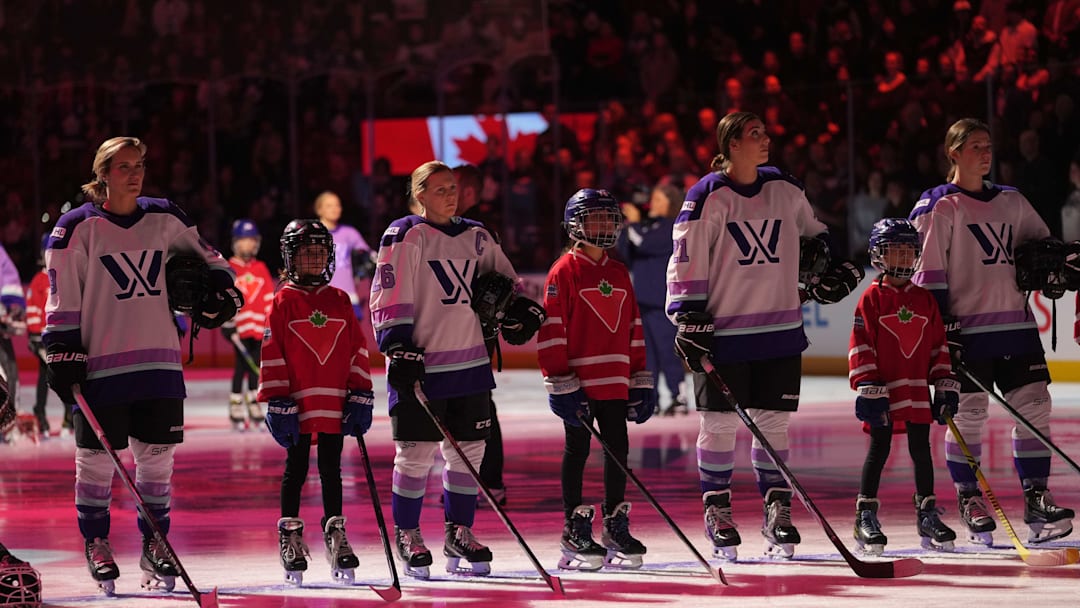 Feb 1, 2024; Toronto, Ontario, CANADA; Members of Team King and minor league players during the anthem before the PWHL 3-on-3 Showcase during NHL All-Star Thursday at Scotiabank Arena. Mandatory Credit: John E. Sokolowski-Imagn Images