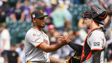 Jul 21, 2024; Denver, Colorado, USA; San Francisco Giants pitcher Camilo Doval (75) and catcher Patrick Bailey (14) celebrate defeating the Colorado Rockies at Coors Field.